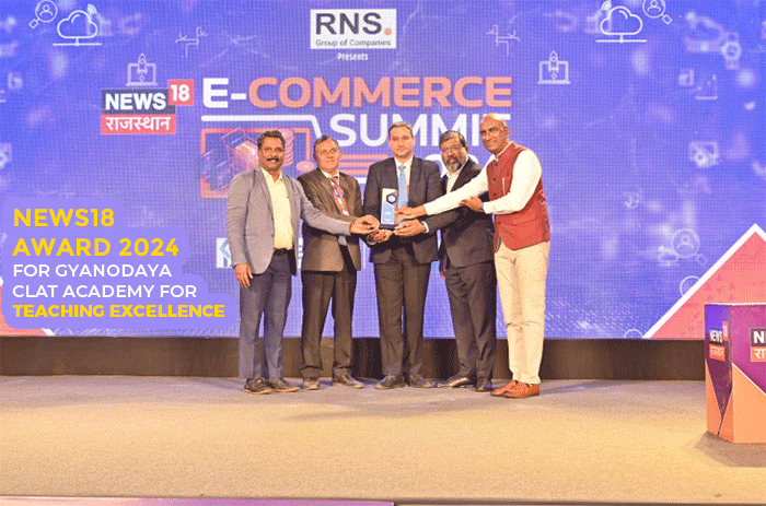 Gyanodaya CLAT Academy representatives receiving the News18 Award 2024 for Teaching Excellence on stage at the News18 Rajasthan Summit