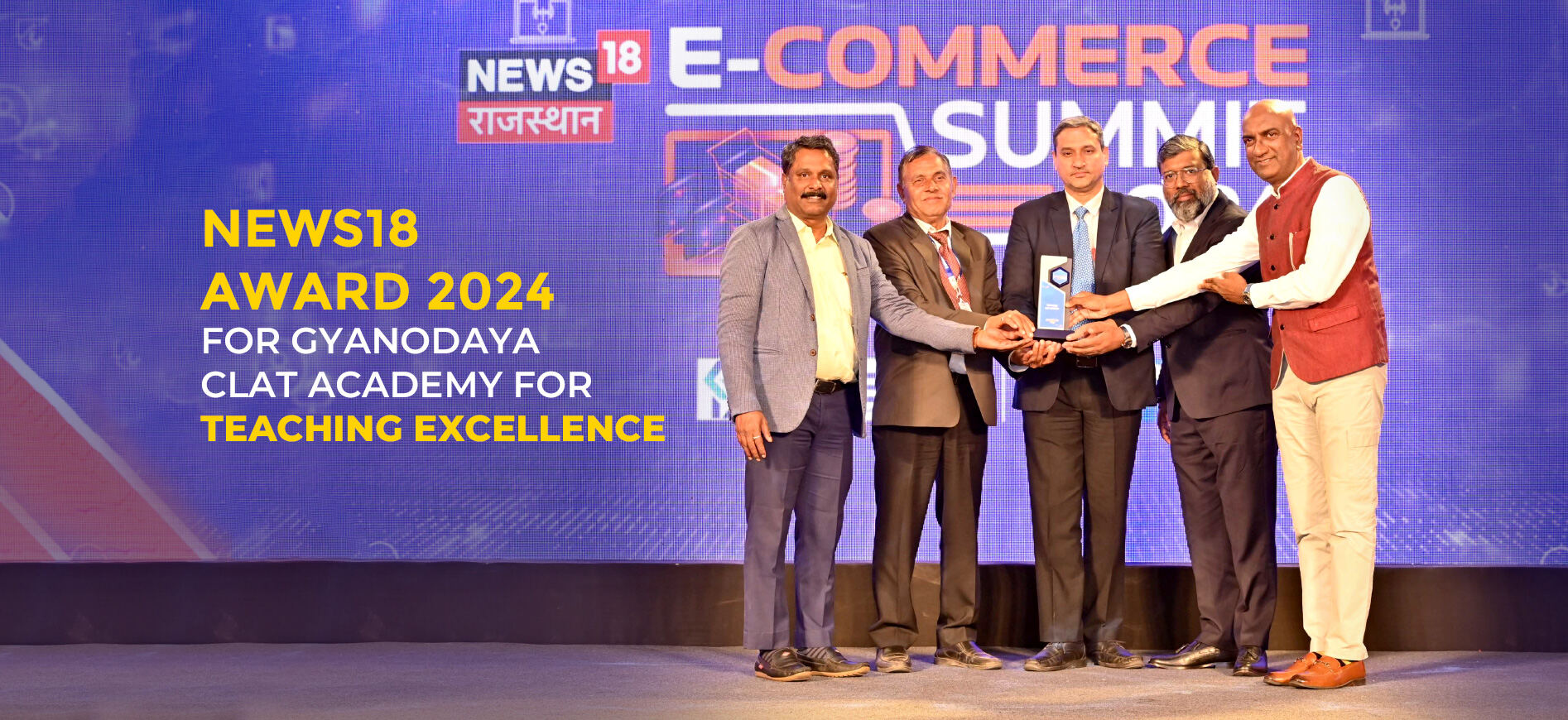 GPS CLAT Academy receiving the News18 Award 2024 for Teaching Excellence on stage